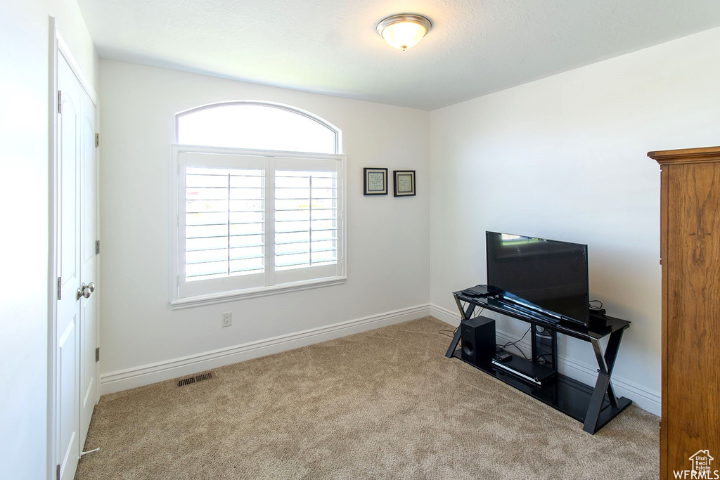Office space with carpet flooring and baseboards