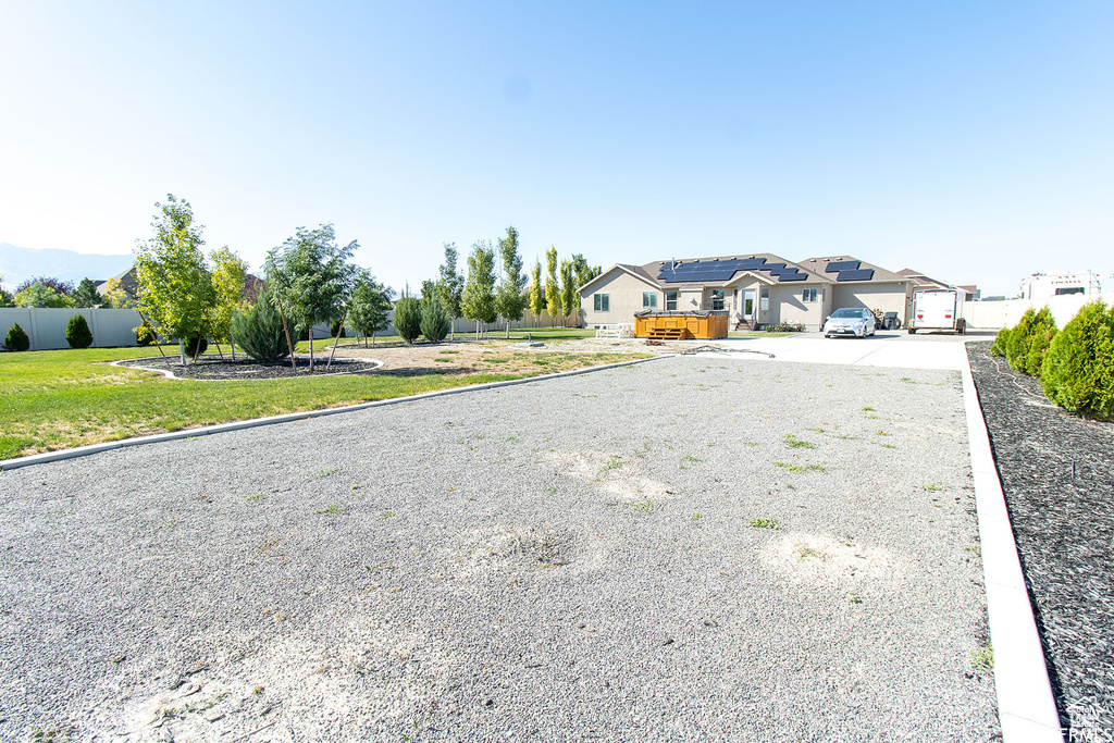 View of front facade featuring gravel driveway
