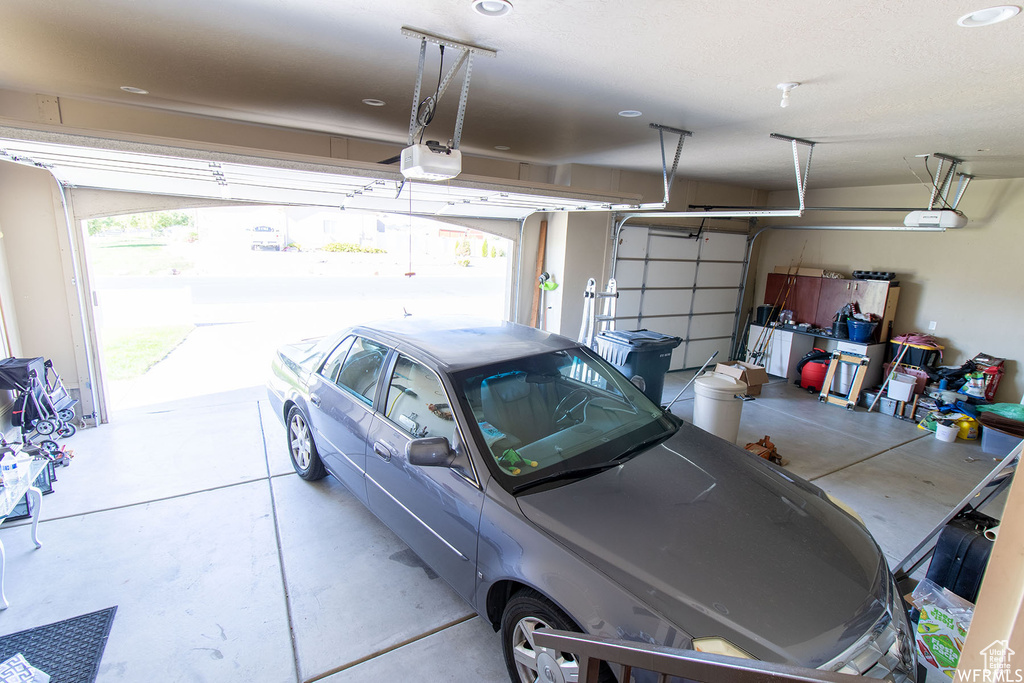 Garage featuring a garage door opener