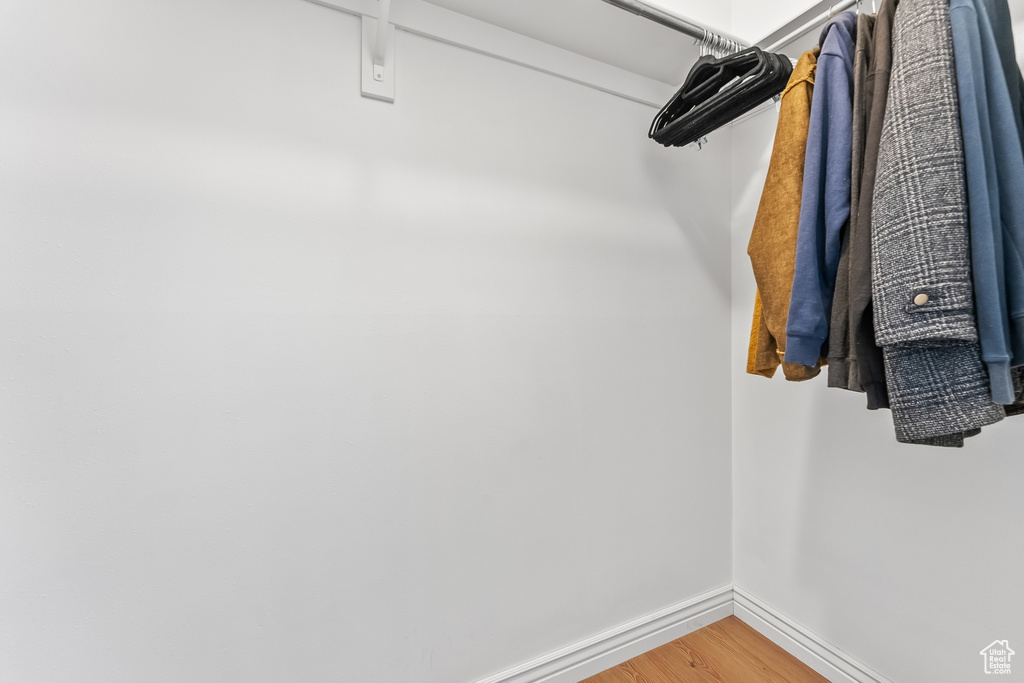 Walk in closet featuring light wood-style flooring