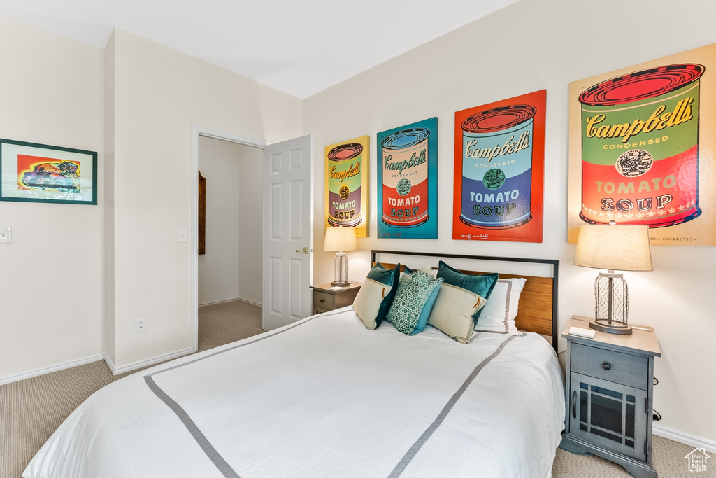 Bedroom with carpet floors and baseboards