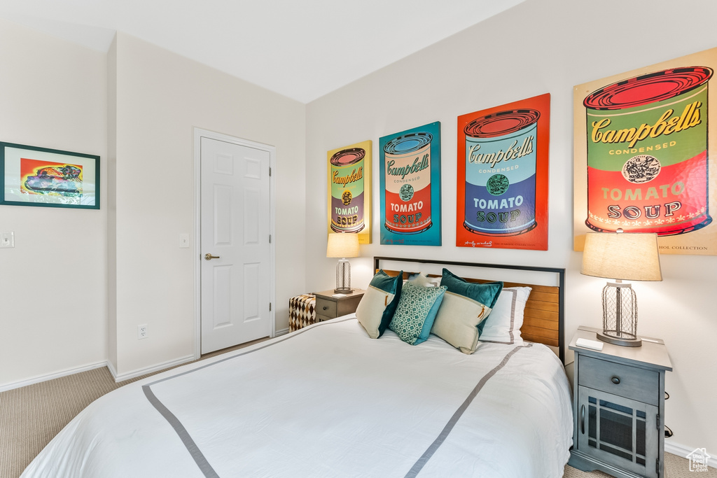 Carpeted bedroom featuring baseboards