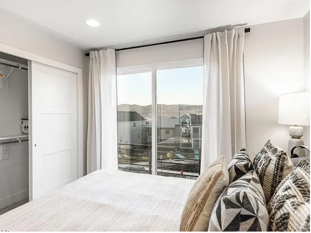 Bedroom featuring recessed lighting and a closet