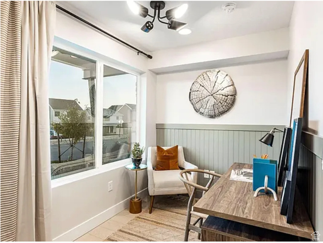 Living area featuring a wainscoted wall