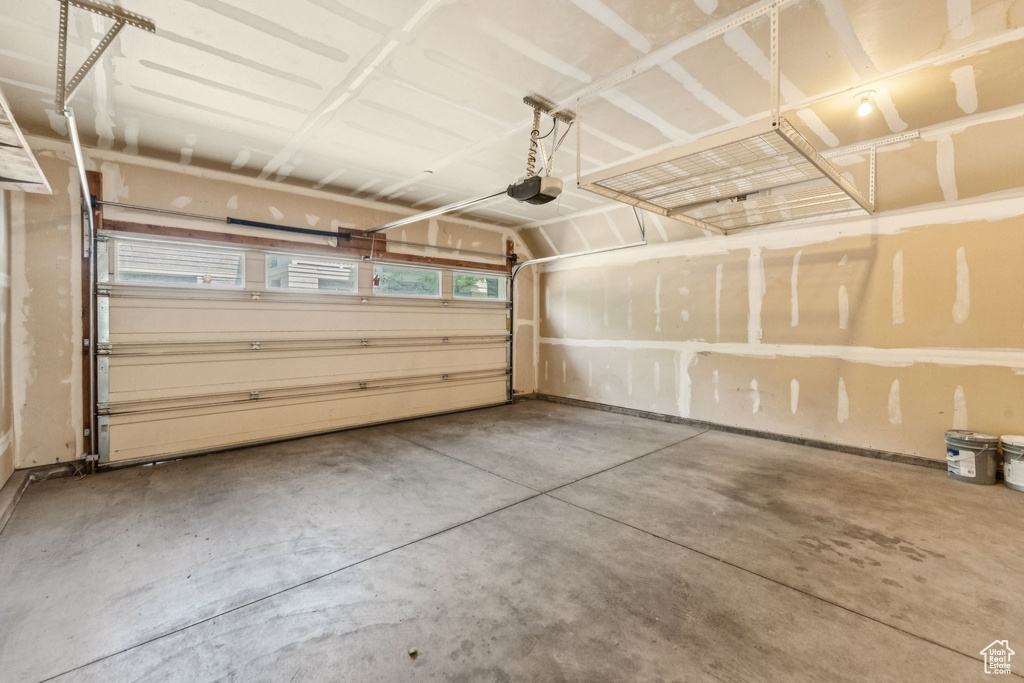Garage featuring a garage door opener