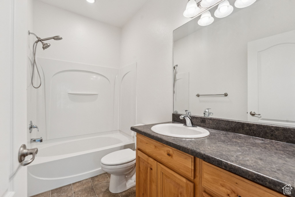 Bathroom featuring vanity and shower / tub combination