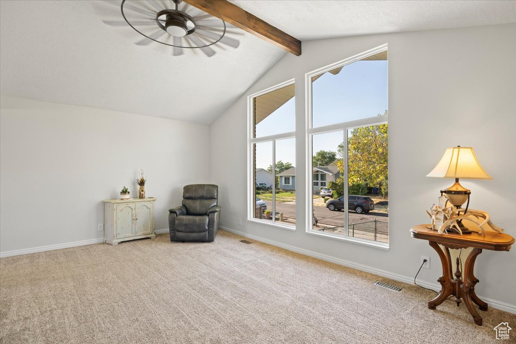 Sitting room with carpet and baseboards