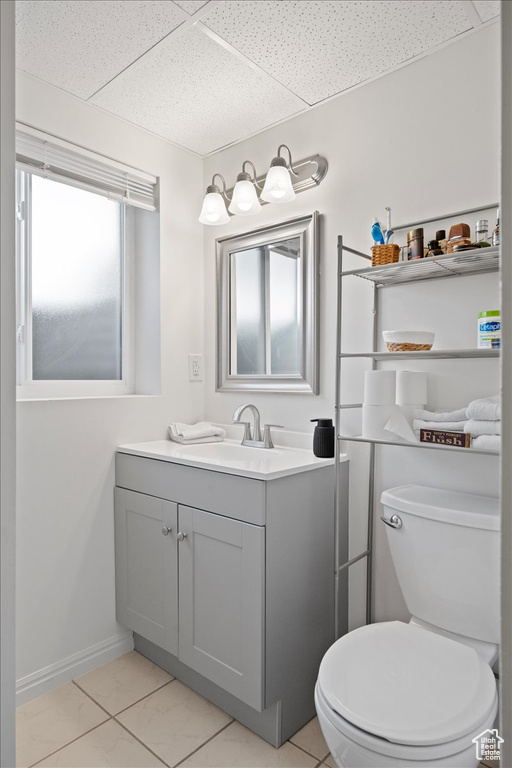 Bathroom with vanity and a paneled ceiling