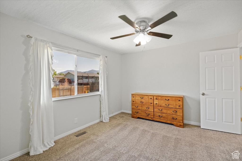 Bedroom featuring carpet flooring and a ceiling fan