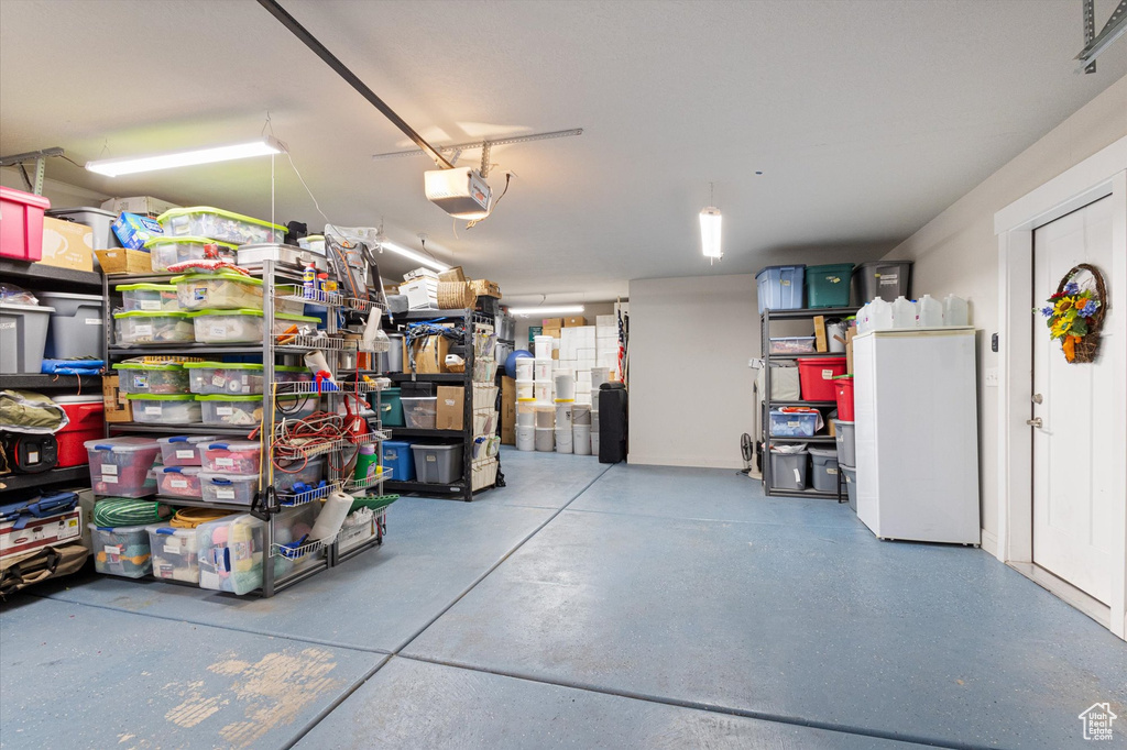 Garage featuring a garage door opener