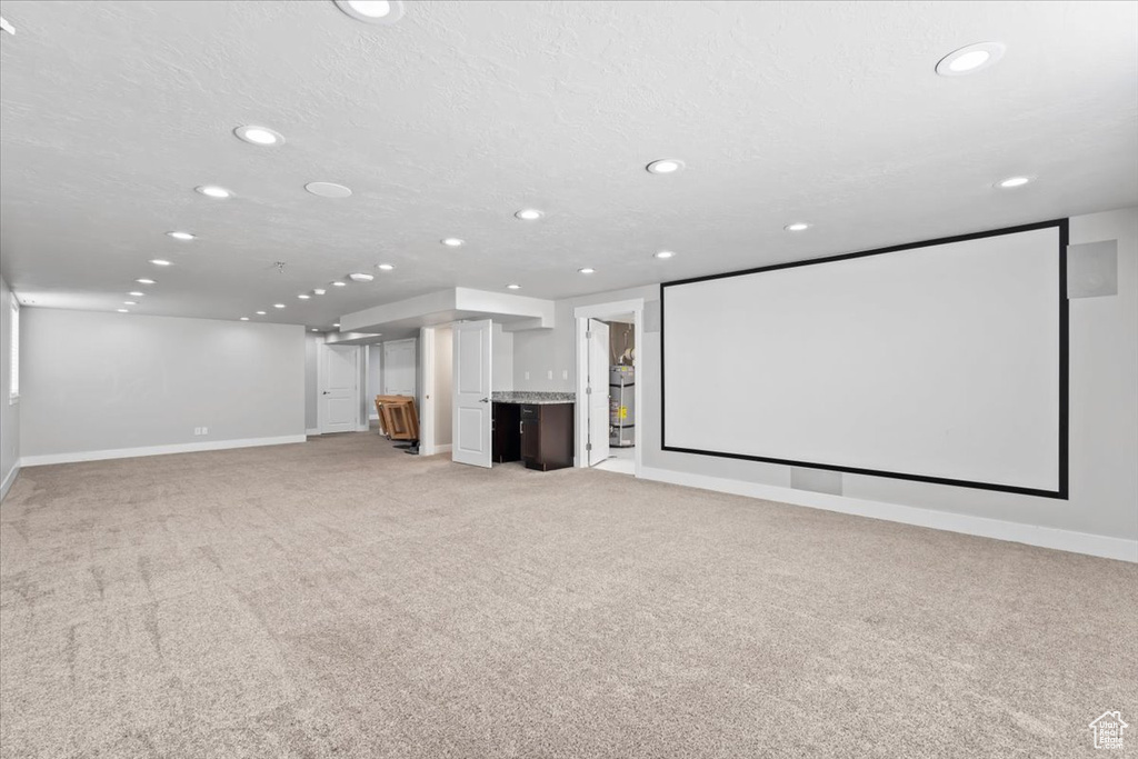 Home theater featuring recessed lighting and light carpet