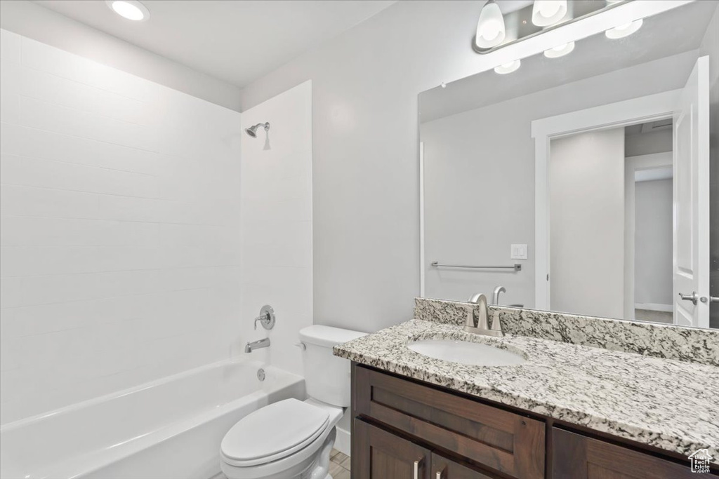 Bathroom featuring vanity and shower / washtub combination