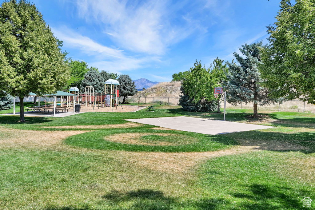 View of basketball court with a mountain view and community basketball court