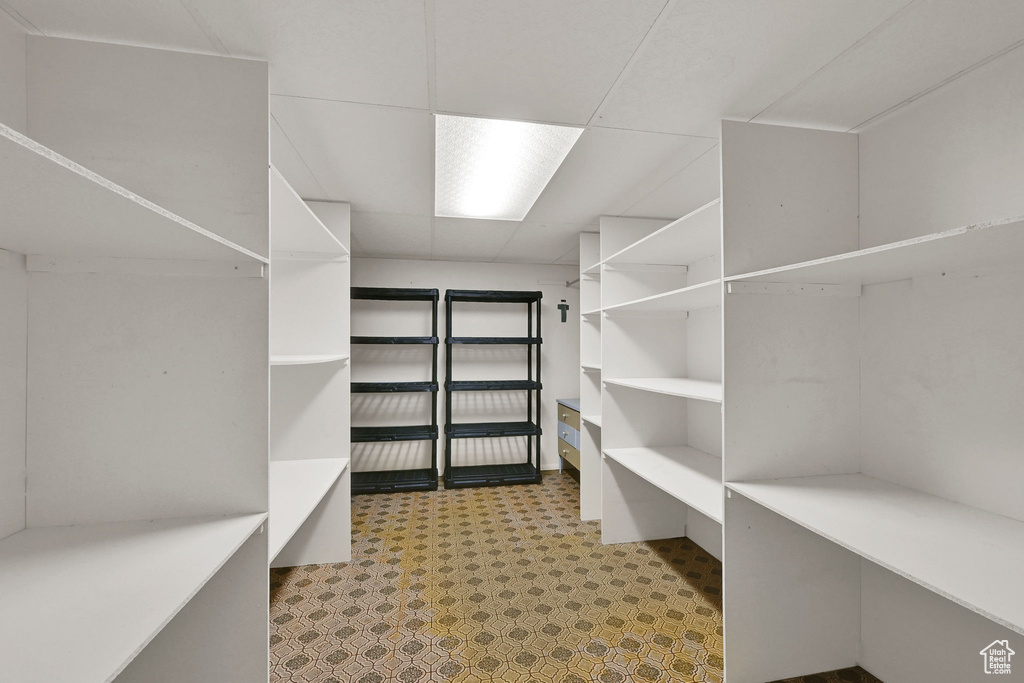 Walk in closet featuring tile patterned floors