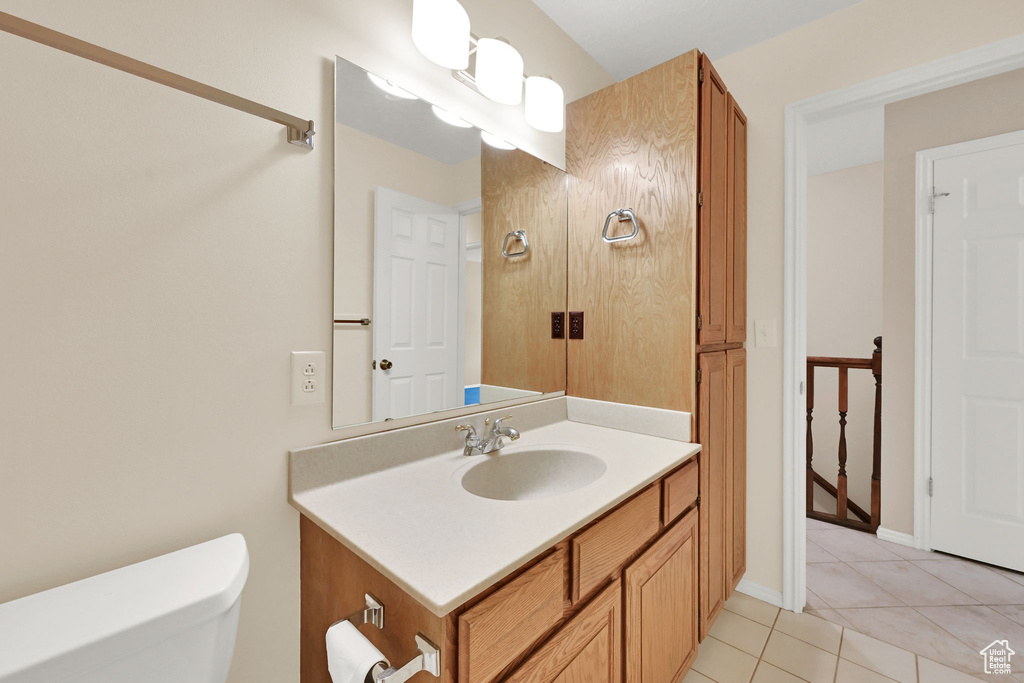 Bathroom with vanity and tile patterned floors