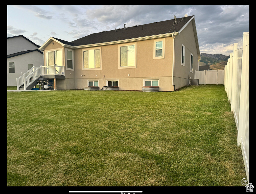 Rear view of property featuring stucco siding