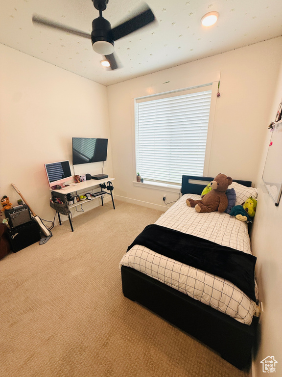 Bedroom with carpet and a ceiling fan