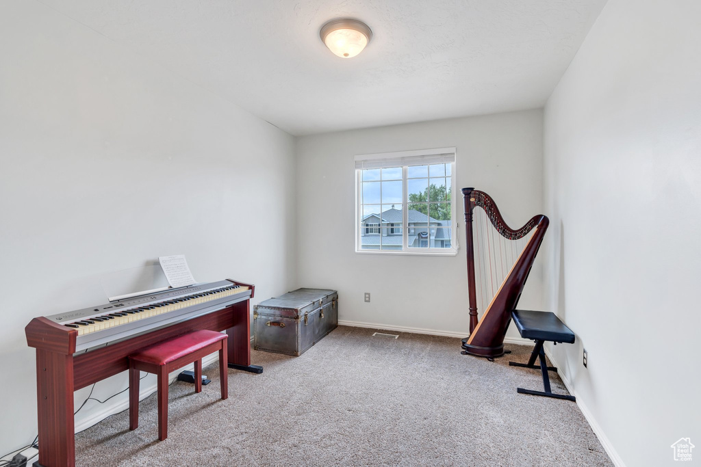 Misc room with carpet and baseboards