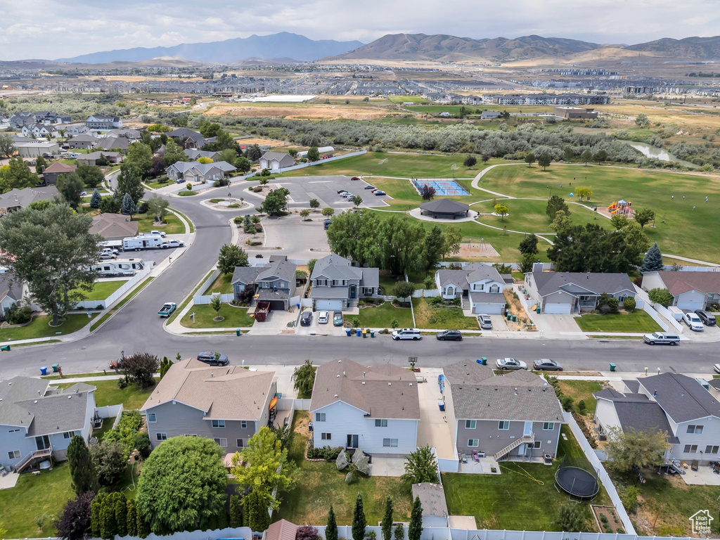 Aerial overview of property\'s location with a mountain backdrop and nearby suburban area