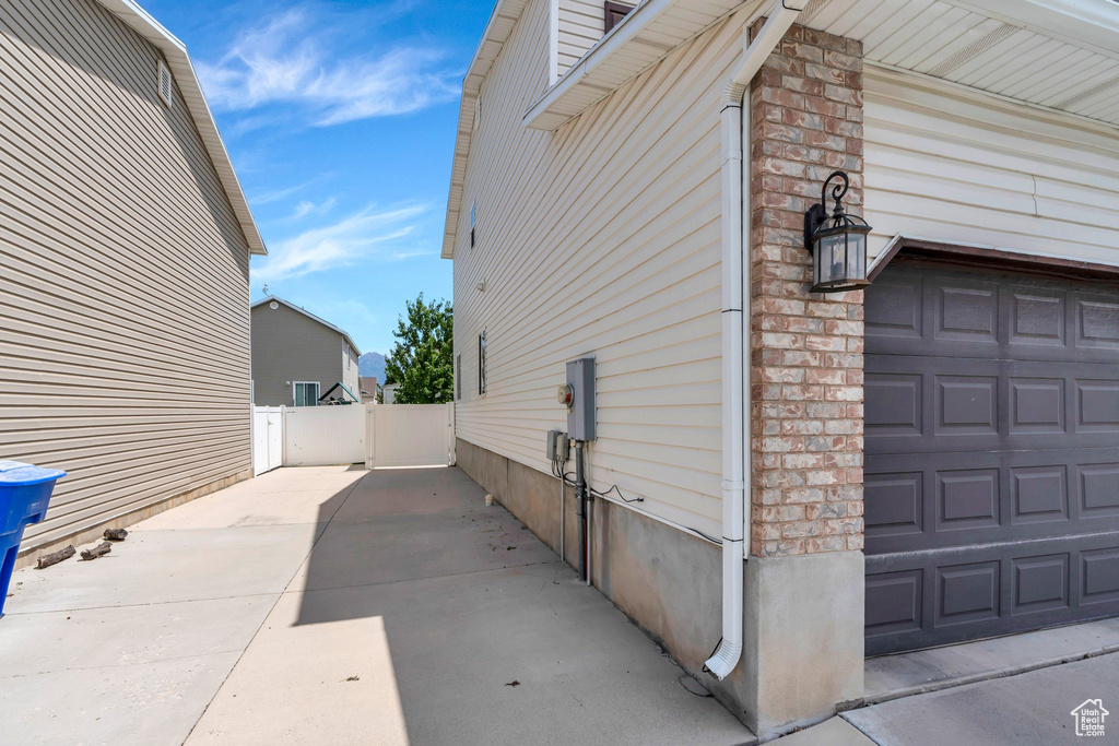 View of property exterior with a garage