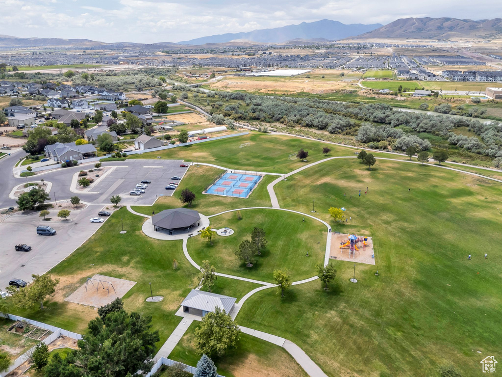 Aerial overview of property\'s location featuring a mountainous background