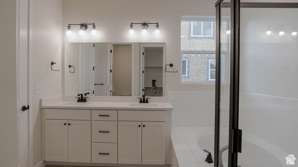 Bathroom with a bath and double vanity