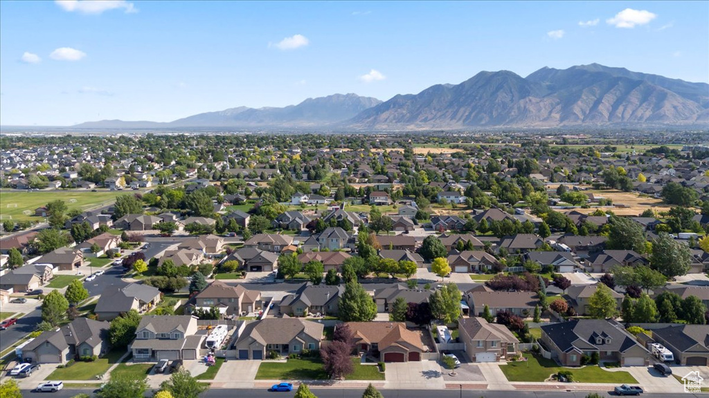 Aerial perspective of suburban area with a mountainous background
