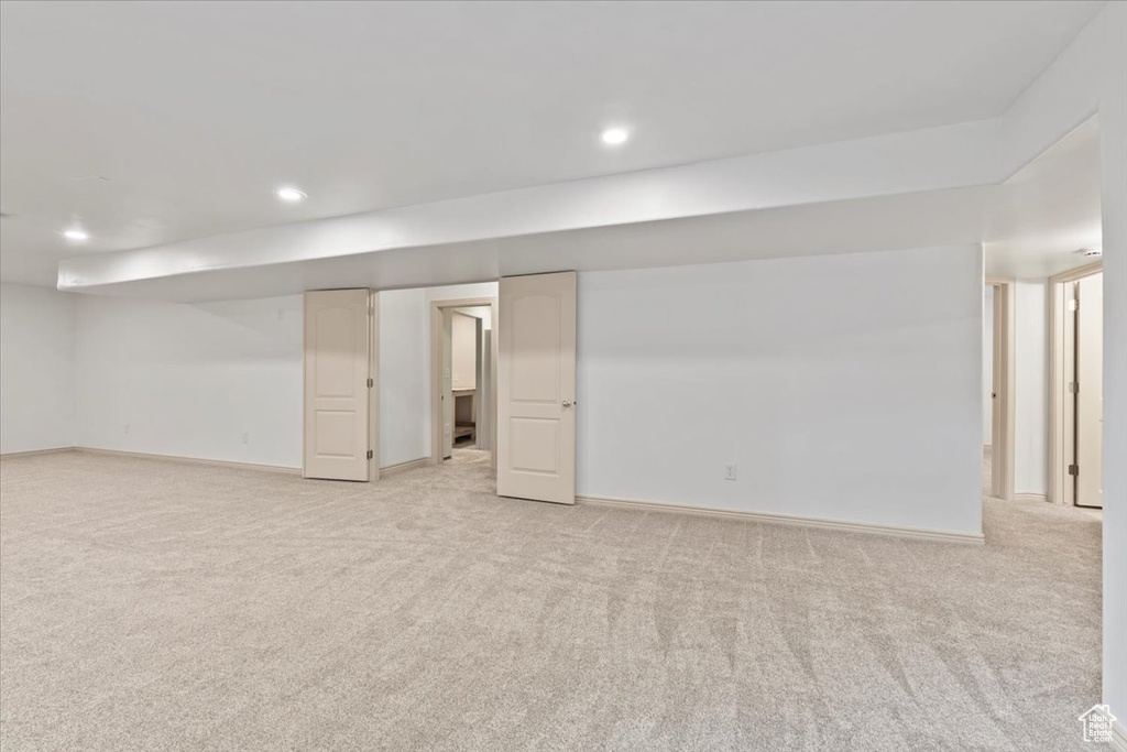 Finished basement featuring light colored carpet and recessed lighting