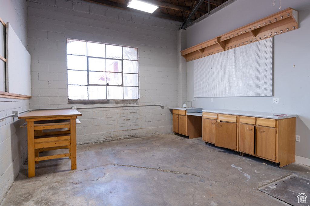 Basement featuring concrete block wall