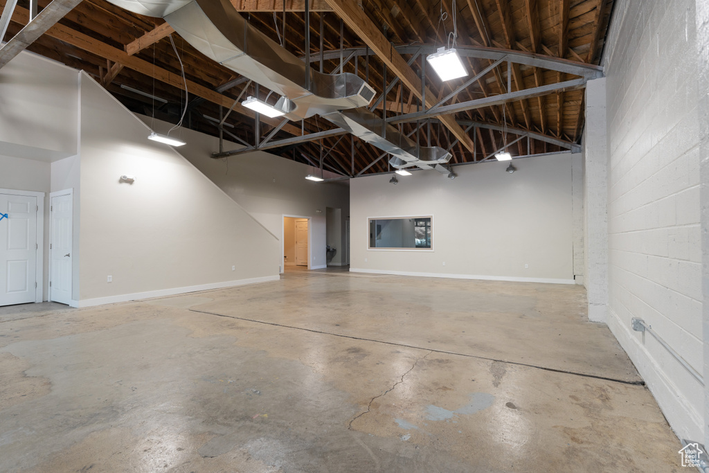 Garage with concrete block wall and baseboards