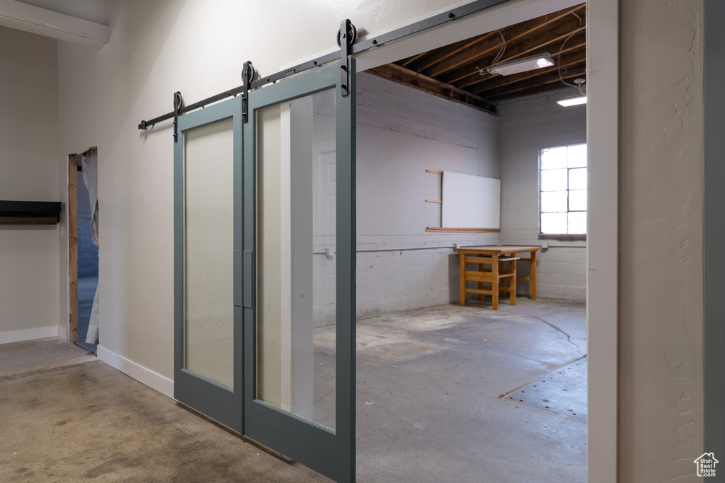 Basement featuring a barn door