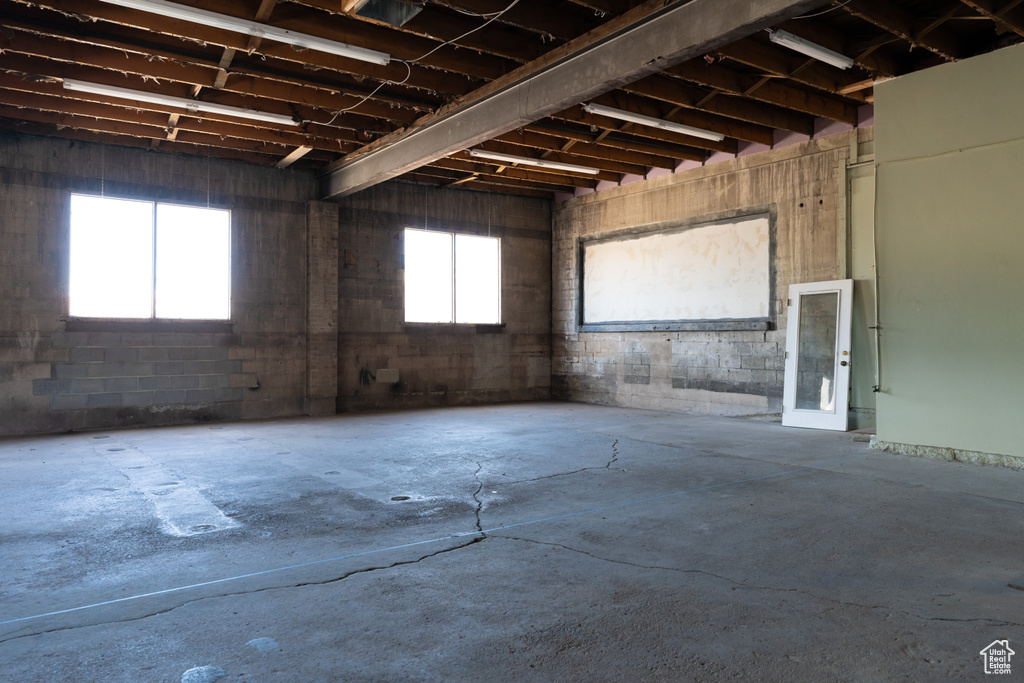 Miscellaneous room with unfinished concrete floors