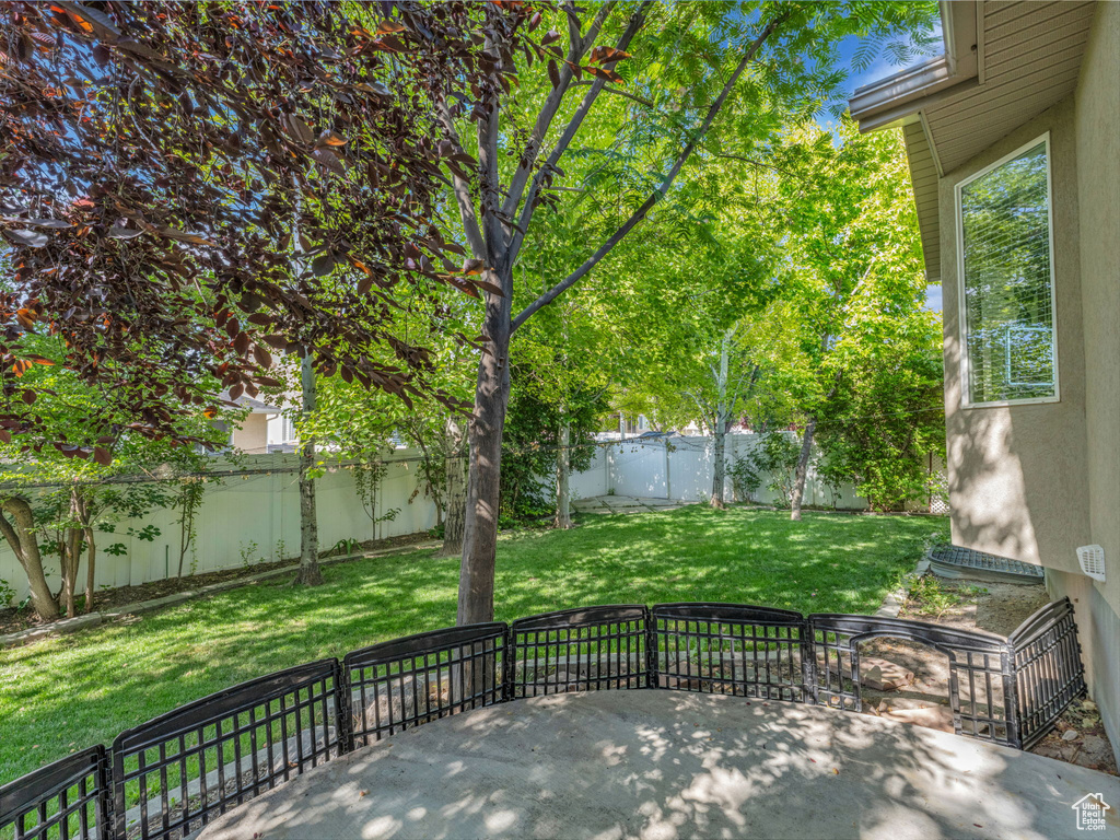 Fenced backyard with a patio area