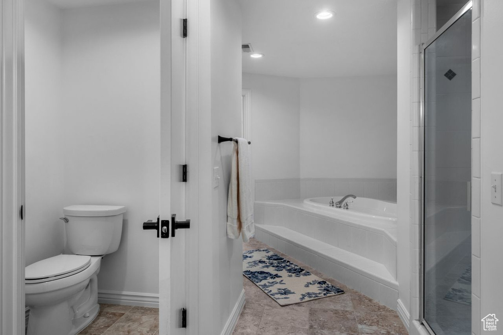 Full bathroom with a bath, a stall shower, and recessed lighting