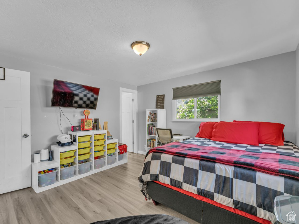 Bedroom with wood finished floors