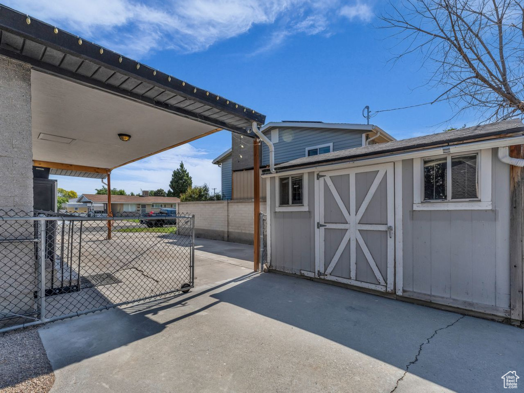 View of patio / terrace with a shed