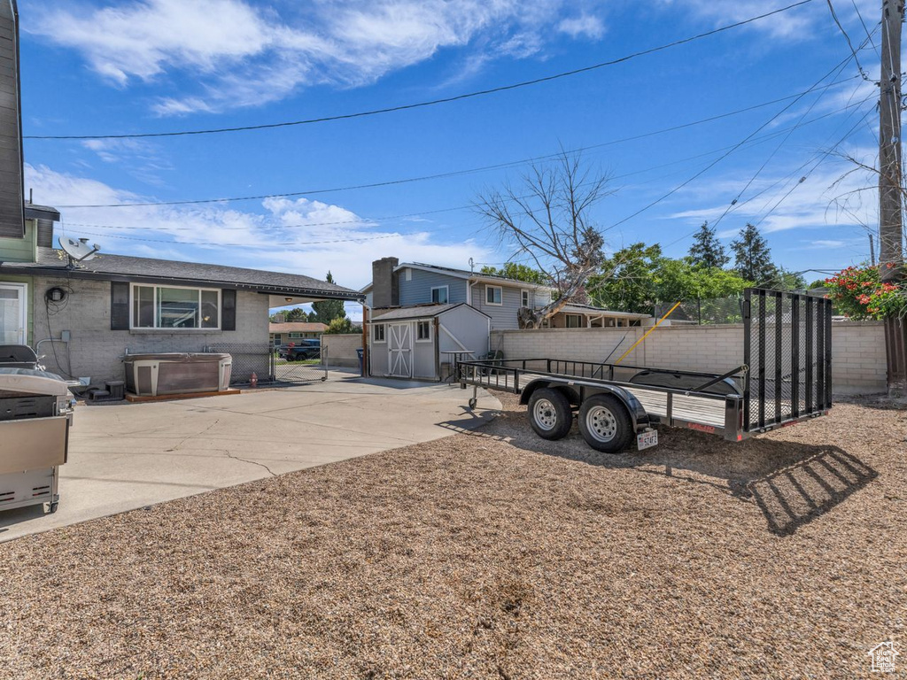 View of yard featuring a shed and driveway
