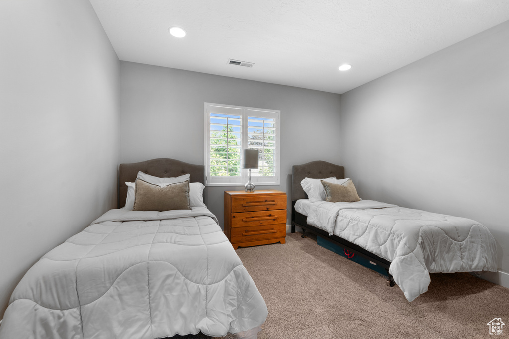 Carpeted bedroom featuring recessed lighting