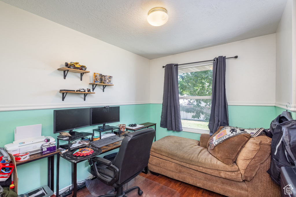 Home office with wood finished floors
