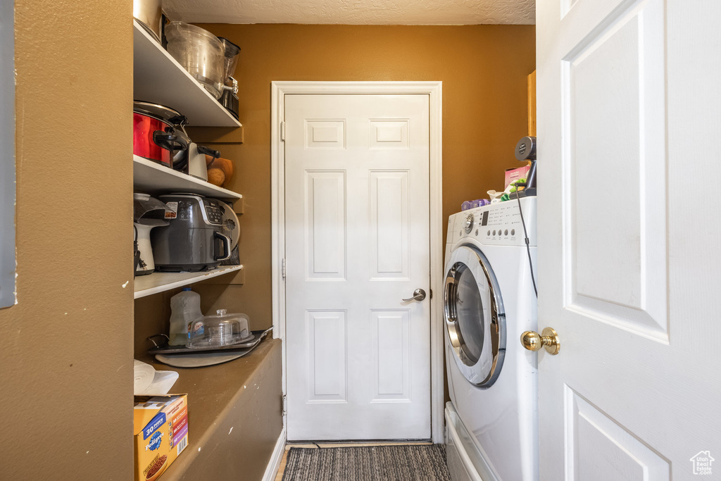 Laundry area featuring washer / dryer
