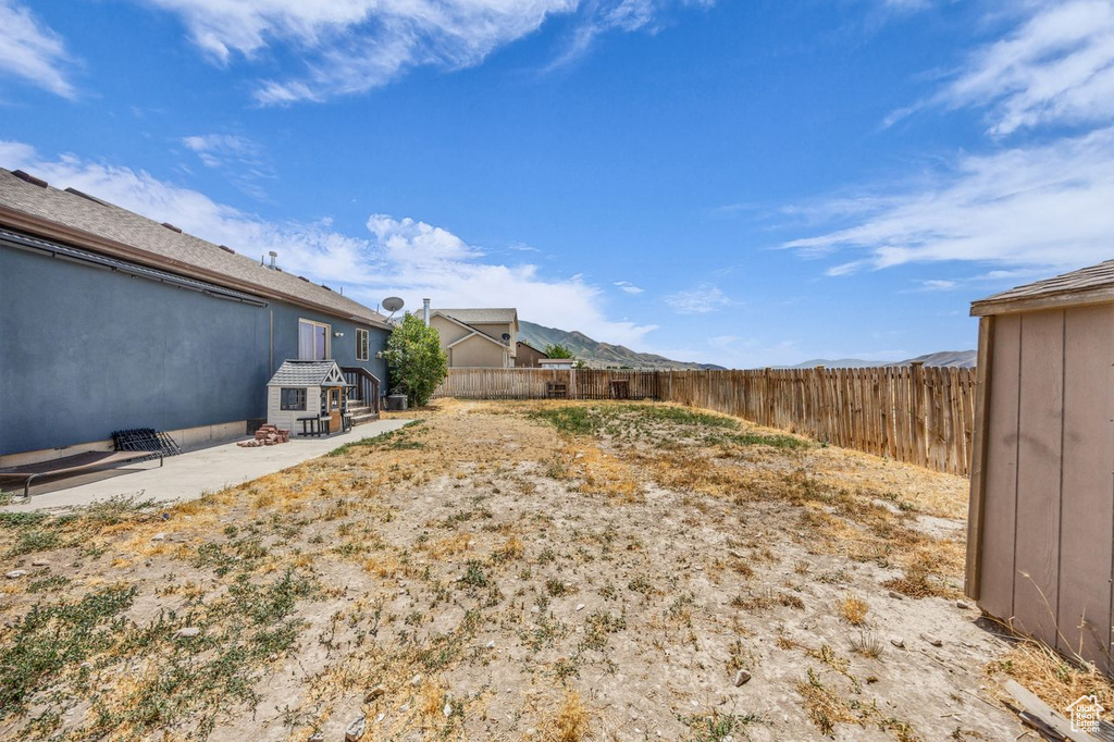 Fenced backyard with a patio