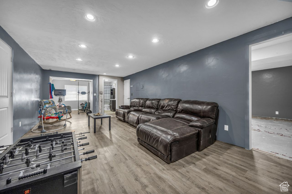 Living room with recessed lighting and wood finished floors