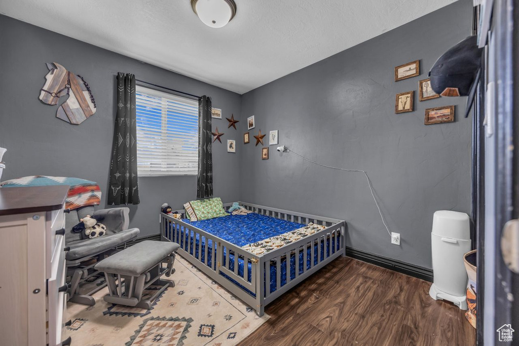 Bedroom featuring wood finished floors
