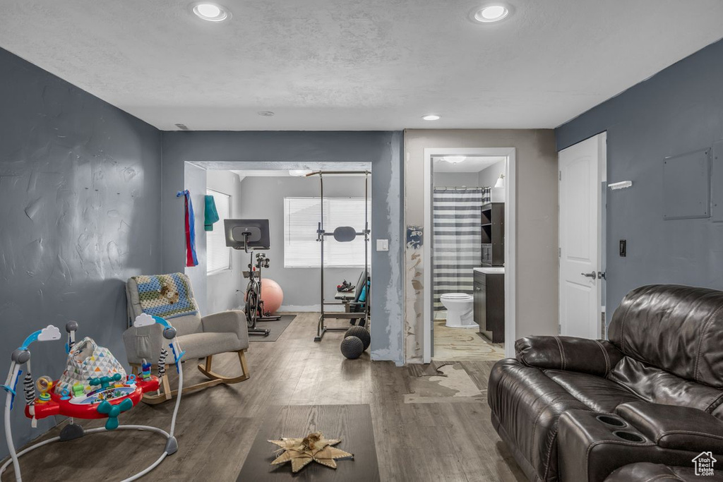 Exercise area featuring wood finished floors and recessed lighting