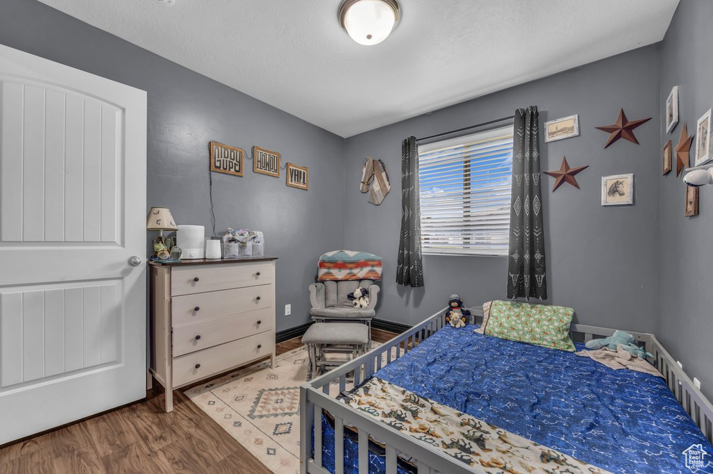 Bedroom featuring wood finished floors
