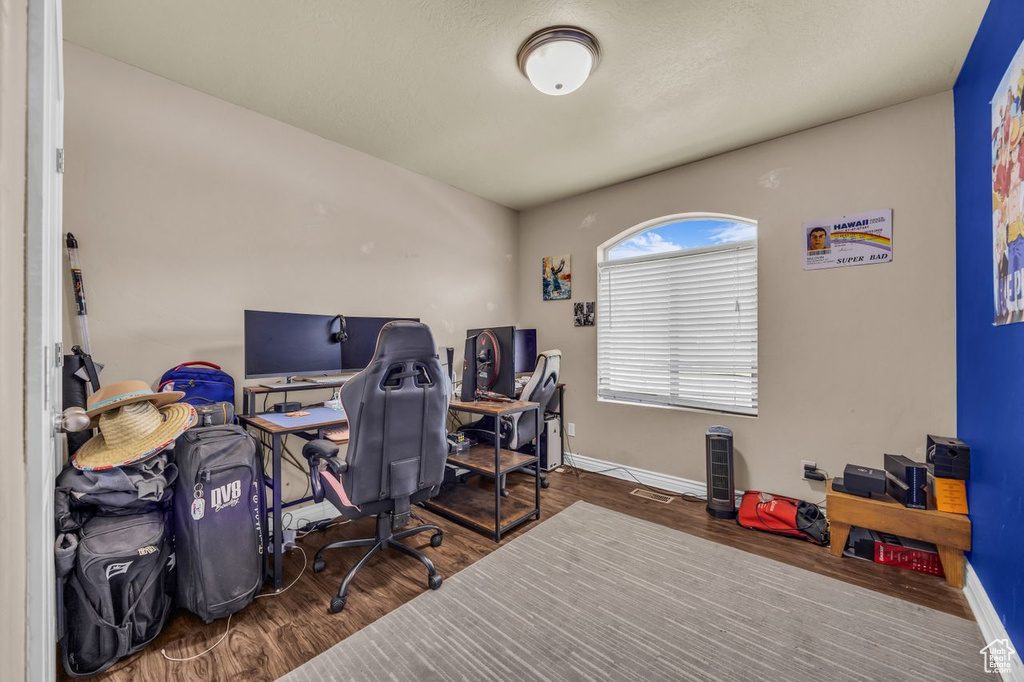 Office area featuring wood finished floors and baseboards