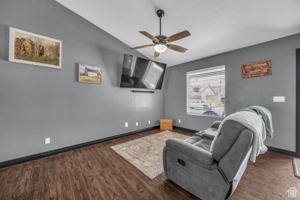 Sitting room featuring wood finished floors, vaulted ceiling, and ceiling fan