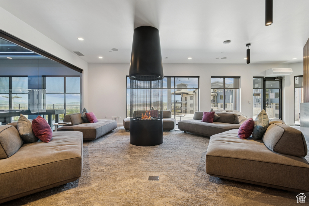 Carpeted living room featuring recessed lighting