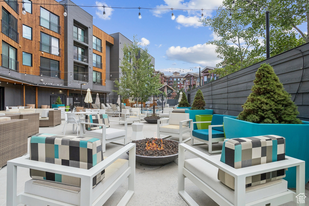 View of patio / terrace featuring an outdoor living space with a fire pit