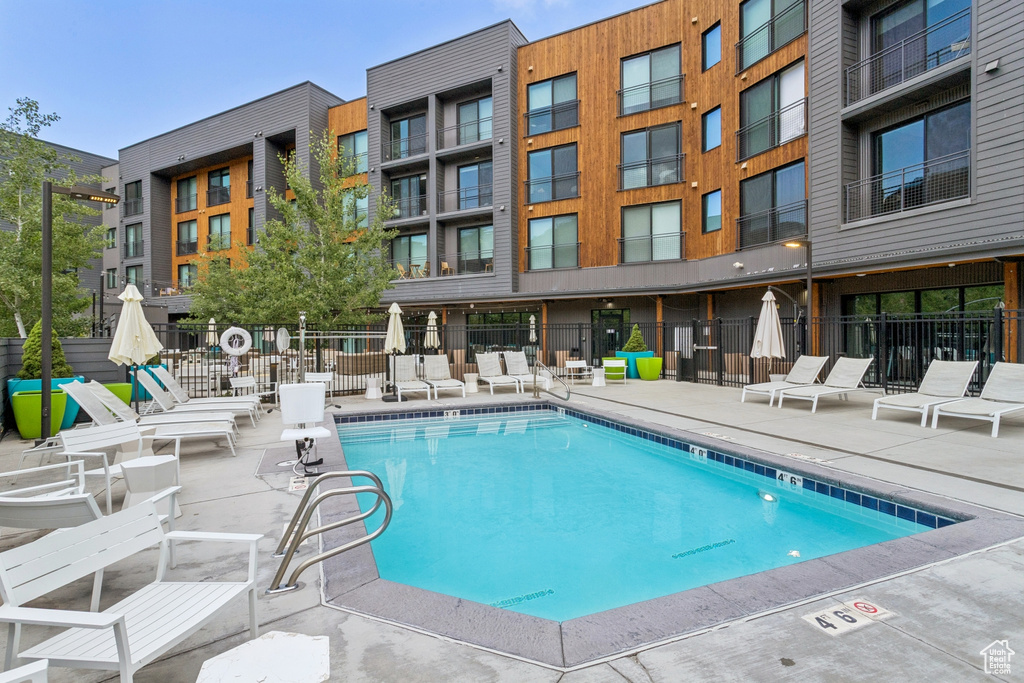 Community pool featuring a patio area